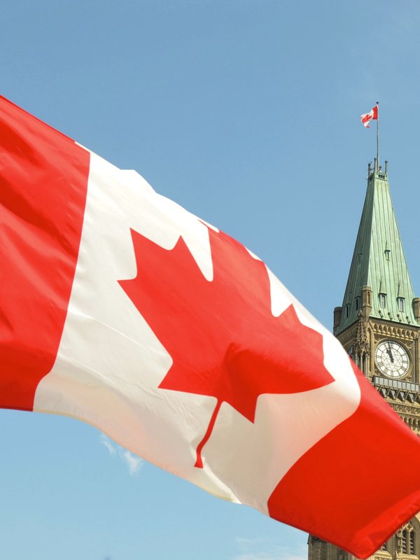 The Canadian flag flying before the Peace Tower in Ottawa